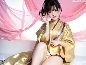 A woman in a kimono is posing for the camera.