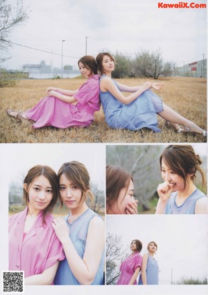 A couple of women sitting on top of a grass covered field.